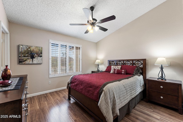 bedroom with ceiling fan, lofted ceiling, hardwood / wood-style floors, and a textured ceiling