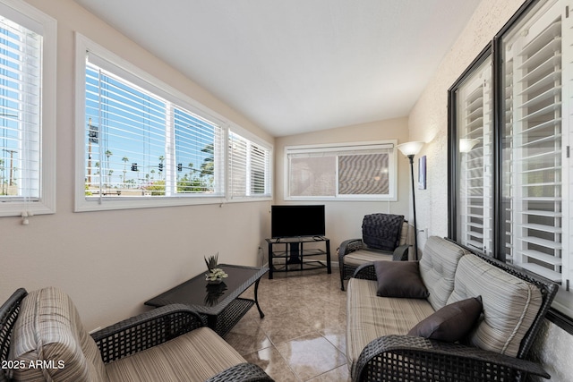 tiled living room with a wealth of natural light