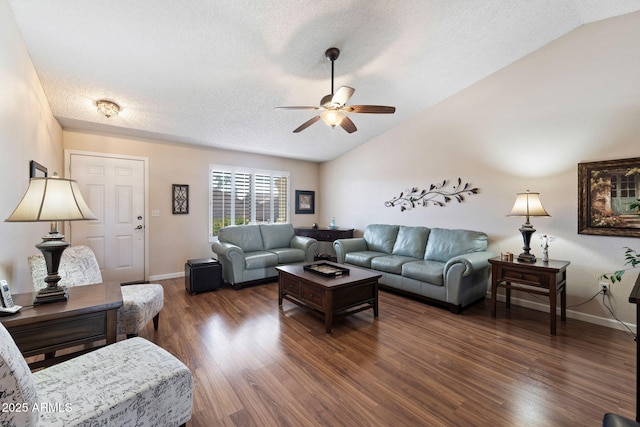 living room featuring lofted ceiling, ceiling fan, dark wood-type flooring, and a textured ceiling