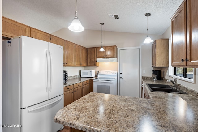 kitchen featuring pendant lighting, lofted ceiling, sink, kitchen peninsula, and white appliances