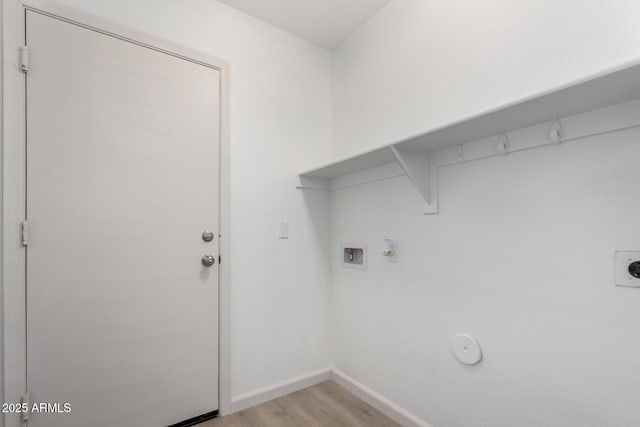 laundry room featuring washer hookup, hookup for a gas dryer, light wood-style flooring, electric dryer hookup, and laundry area