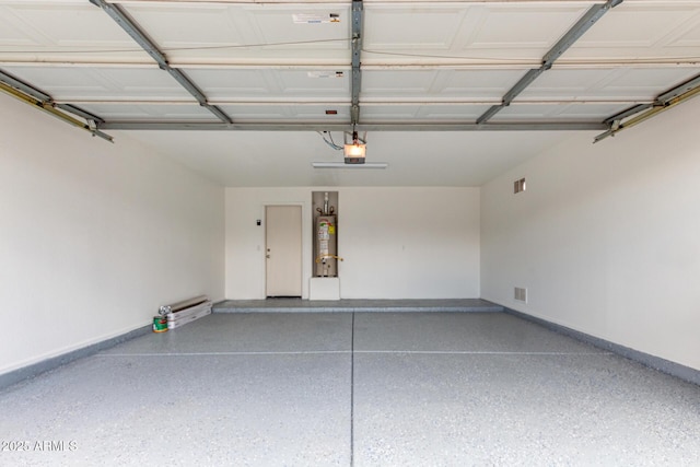 garage with water heater, baseboards, and a garage door opener