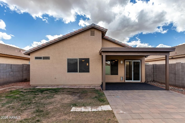 back of property featuring a patio area, a fenced backyard, and stucco siding