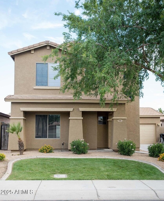 view of front of house featuring a front yard and stucco siding