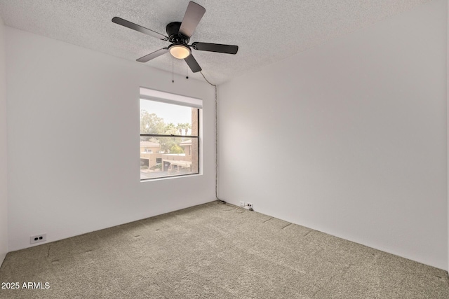 unfurnished room featuring ceiling fan, a textured ceiling, and carpet flooring