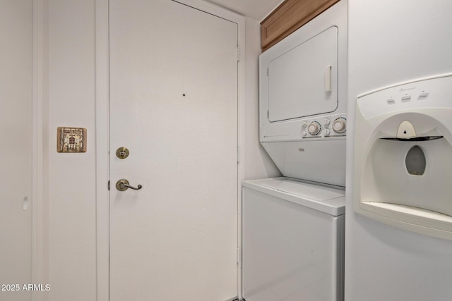 laundry room featuring stacked washer and dryer