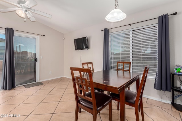 tiled dining room with vaulted ceiling and ceiling fan