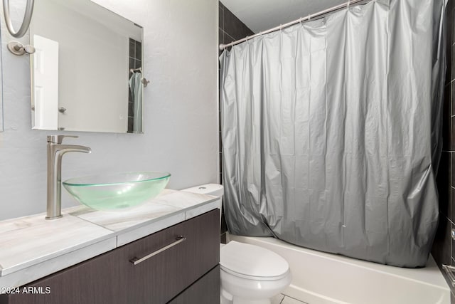 full bathroom featuring vanity, toilet, and shower / tub combo