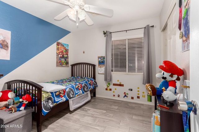 bedroom featuring ceiling fan and light hardwood / wood-style floors