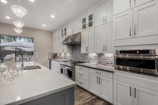 4519 N 29th Way, Phoenix, AZ 85016 - kitchen with a sink, appliances with stainless steel finishes, under cabinet range hood, recessed lighting, and tasteful backsplash
