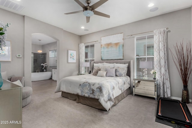 4519 N 29th Way, Phoenix, AZ 85016 - carpeted bedroom featuring arched walkways, recessed lighting, a ceiling fan, and ensuite bath