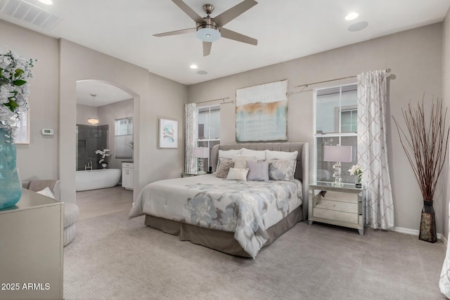 4519 N 29th Way, Phoenix, AZ 85016 - bedroom with arched walkways, carpet floors, recessed lighting, baseboards, and connected bathroom