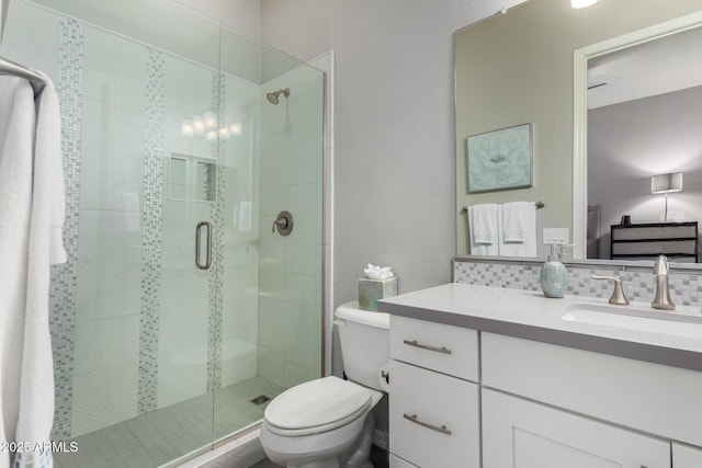 4519 N 29th Way, Phoenix, AZ 85016 - bathroom featuring vanity, toilet, a shower stall, and decorative backsplash