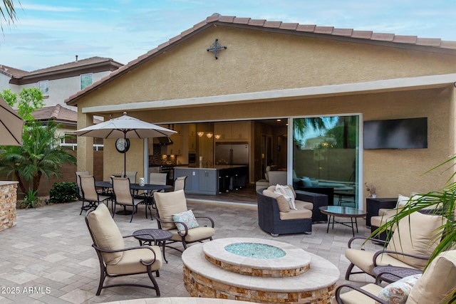 4519 N 29th Way, Phoenix, AZ 85016 - view of patio / terrace with an outdoor living space with a fire pit and outdoor dining space
