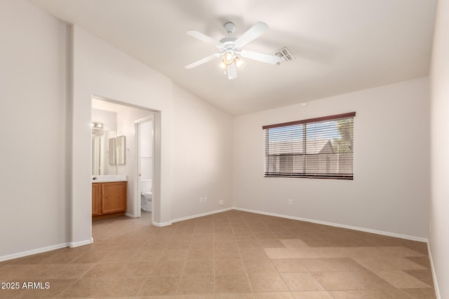 9332 W Mary Ann Dr, Peoria, AZ 85382 - unfurnished bedroom with lofted ceiling, baseboards, ensuite bathroom, light tile patterned floors, and a ceiling fan