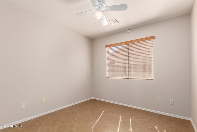 9332 W Mary Ann Dr, Peoria, AZ 85382 - unfurnished room featuring light tile patterned flooring, a ceiling fan, and baseboards