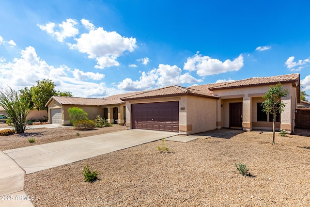 9332 W Mary Ann Dr, Peoria, AZ 85382 - ranch-style house with an attached garage, stucco siding, driveway, and a tile roof