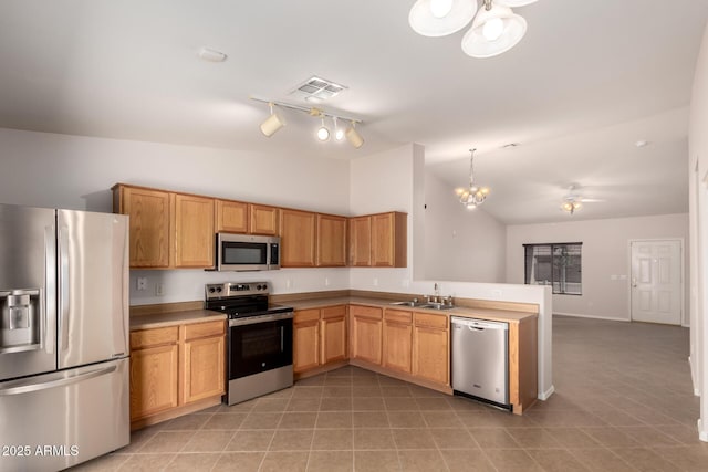 9332 W Mary Ann Dr, Peoria, AZ 85382 - kitchen featuring stainless steel appliances, lofted ceiling, a chandelier, a peninsula, and open floor plan