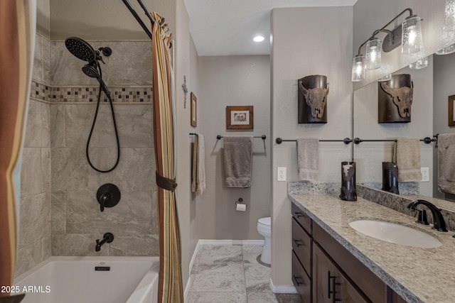 full bathroom featuring vanity, tiled shower / bath combo, and toilet