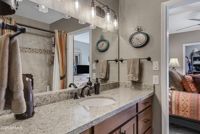 bathroom featuring vanity and a shower with shower curtain