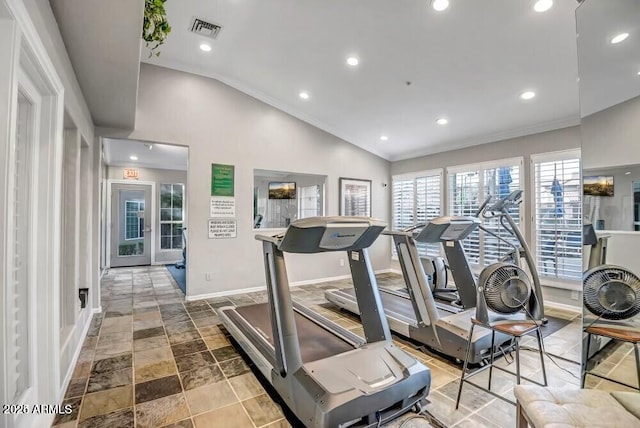 workout area with crown molding and lofted ceiling