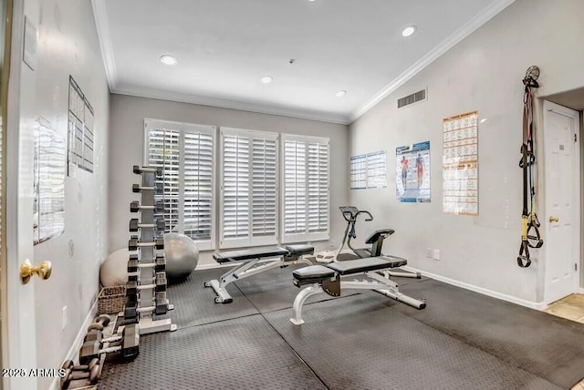 workout area featuring crown molding