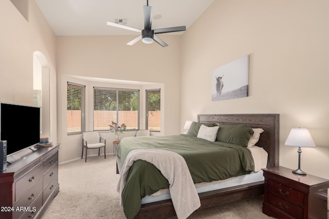 carpeted bedroom with a ceiling fan, visible vents, and baseboards