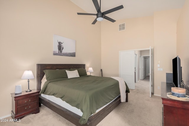 bedroom featuring light colored carpet, visible vents, a ceiling fan, high vaulted ceiling, and baseboards