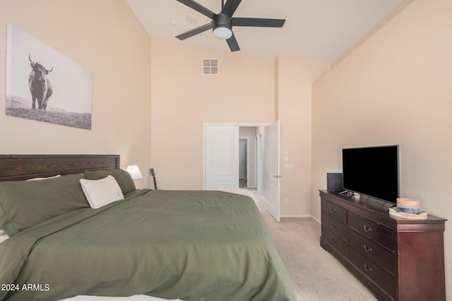 bedroom with baseboards, visible vents, a ceiling fan, light colored carpet, and lofted ceiling