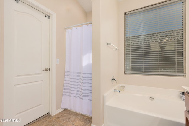 bathroom featuring a garden tub, tile patterned flooring, and a shower with shower curtain