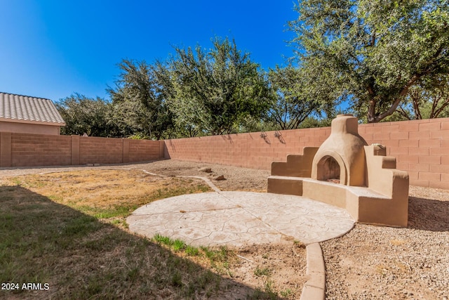 view of yard with a patio area and a fenced backyard