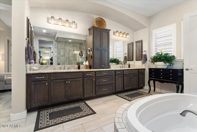 bathroom with vanity and plus walk in shower