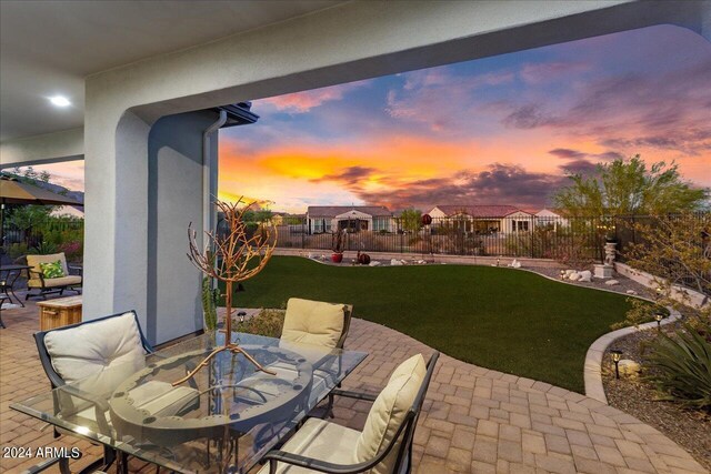 patio terrace at dusk with a lawn