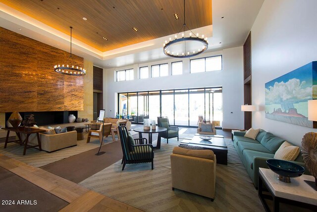 game room featuring billiards, dark colored carpet, and a tray ceiling