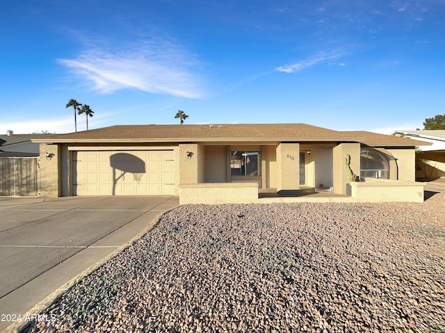 single story home featuring a garage