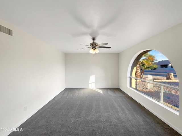 carpeted empty room with ceiling fan