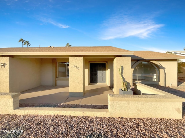 view of front of home featuring a patio area