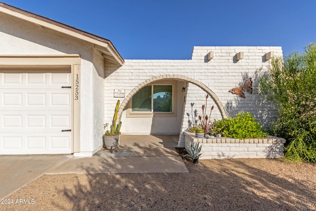 property entrance featuring a garage