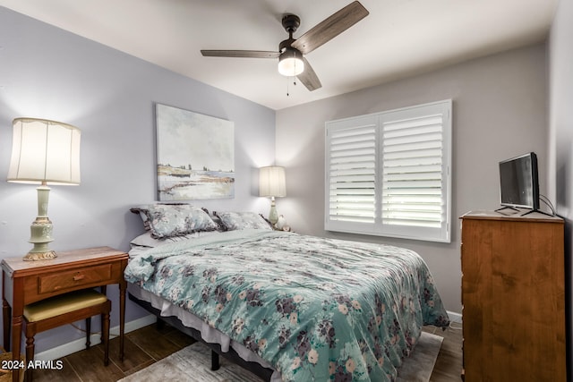 bedroom featuring dark hardwood / wood-style floors and ceiling fan