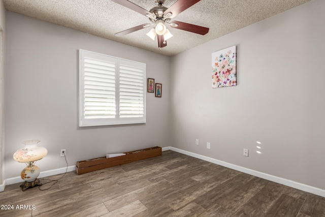 spare room featuring hardwood / wood-style floors, a textured ceiling, and ceiling fan