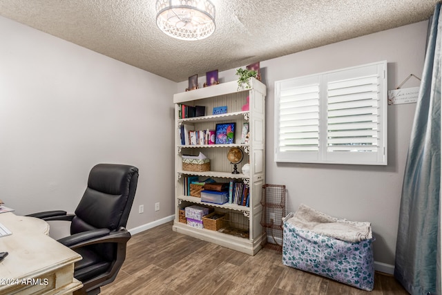 office space with hardwood / wood-style floors and a textured ceiling