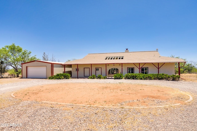 ranch-style home featuring a garage