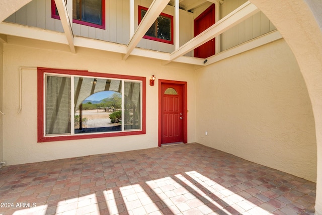 doorway to property with a patio