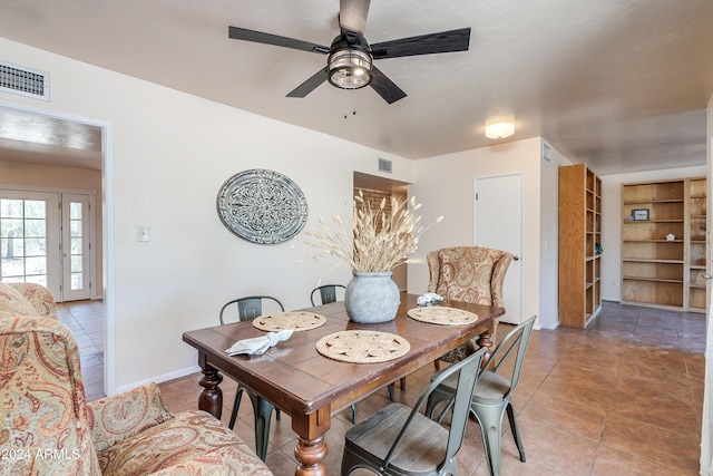 tiled dining room with ceiling fan