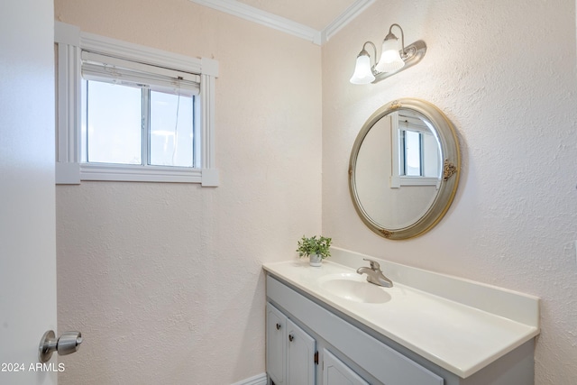 bathroom featuring ornamental molding and vanity