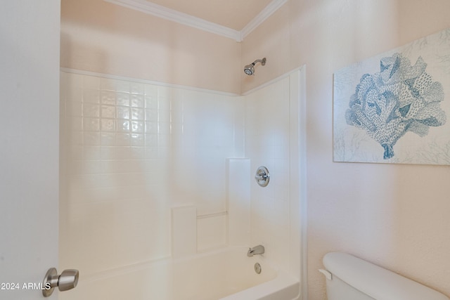 bathroom with ornamental molding, toilet, and shower / bathing tub combination