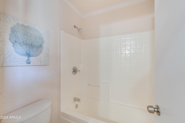 bathroom with ornamental molding, toilet, and  shower combination