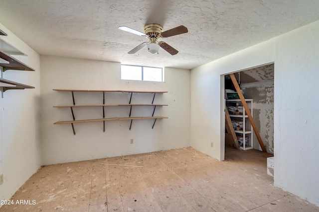 basement featuring ceiling fan