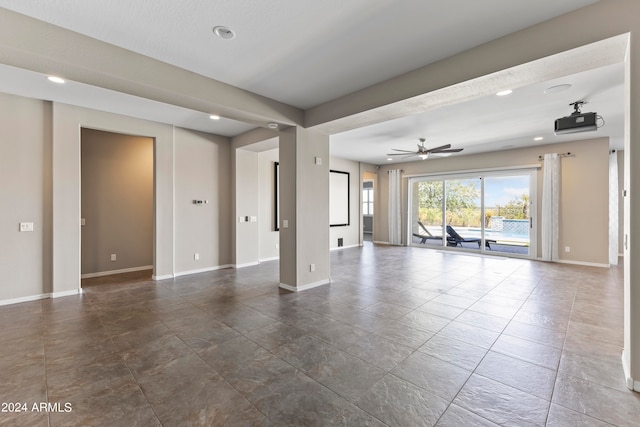 unfurnished living room featuring ceiling fan