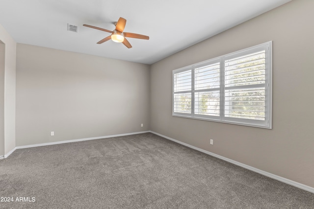 unfurnished room featuring carpet floors and ceiling fan